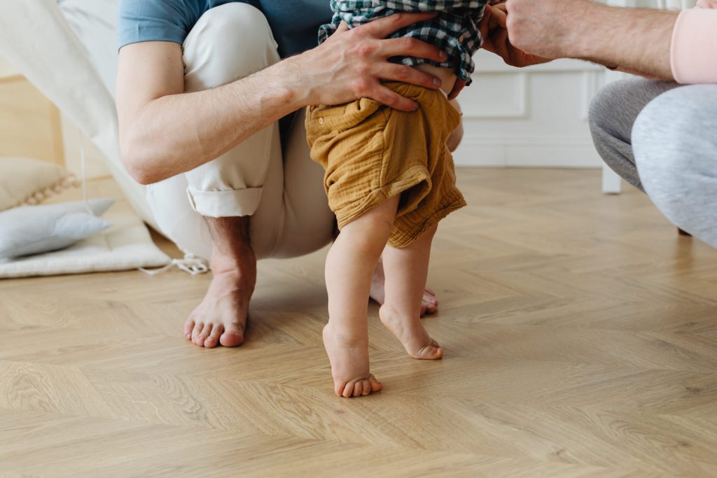 baby walking barefoot