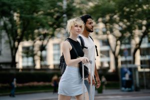 casual everyday minimalist style couple walking in the street